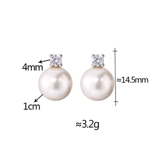Detail view of pearl and zircon stud earrings with precise dimensions 14.5mm in height