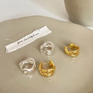 Crossed multi-layer geometric metal hoop earrings in gold and silver finish set