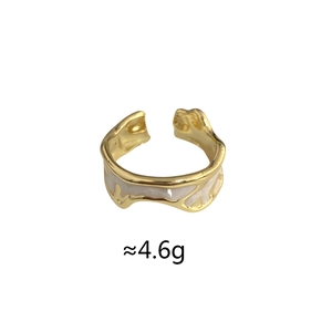Detail of vintage enamel gold ring featuring fluid wavy edges and adjustable open band