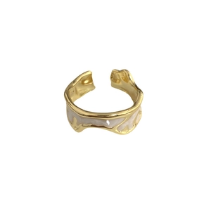 Vintage gold adjustable open ring with irregular lava texture and white enamel inlay