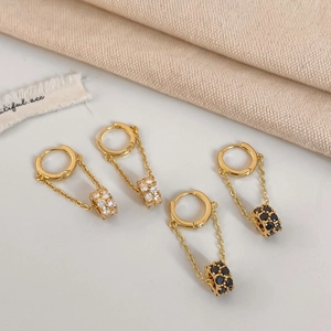 Elegant gold hoop earrings with long tassels and sparkling zircon stone ball pendants