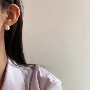 Minimalist silver bar pearl stud earrings shown on model for a modern elegant look
