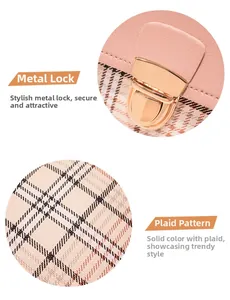 Detail of pink leather flap with golden push-lock hardware and classic plaid fabric texture