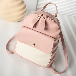 Minimalist two-tone leather mini backpack in pink and white with adjustable straps