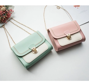 Detail of mini chain handbags in mint green and rose pink with gold metal locks