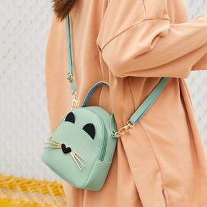 Mint green mini crossbody cat bag with black ears and gold hardware for women