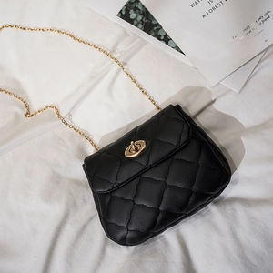 Classic black quilted leather crossbody bag with gold chain strap and metal swivel lock