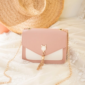 Chic pink and white contrast crossbody bag with cat-ear buckle and gold tassel
