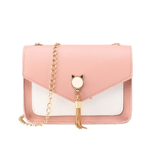 Pink and white patchwork shoulder bag with cat ear metal clasp and gold tassel detail