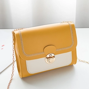 Chic yellow and cream patchwork mini crossbody bag with gold chain strap and stitching