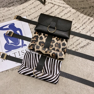 Three stylish belt bags in black, leopard, and zebra print with gold ring buckles