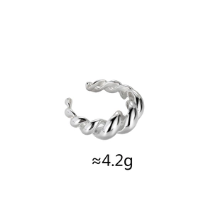 Macro shot of silver twisted metal adjustable ring featuring a polished croissant design