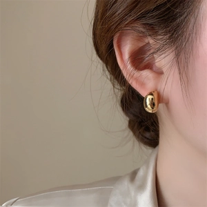 Elegant minimalist gold bean earrings with mirror polish finish for a classic look