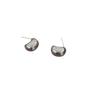 Elegant minimalist bean-shaped silver stud earrings with a polished metallic finish