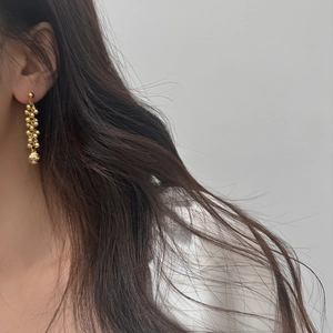 Elegant gold-tone beaded tassel earrings with freshwater pearl pendant for a stylish look