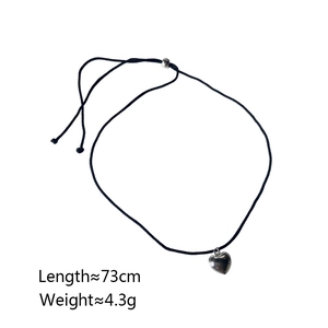 Detail of 73cm woven cord necklace with silver heart pendant and metal clasp