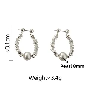 Detail of silver irregular beads hoop earrings with an 8mm pearl and size dimensions