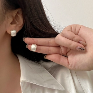 Elegant brushed silver C-shape stud earrings for women with a minimalist matte metal finish