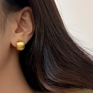 Elegant matte gold circular stud earrings for women with minimalist brushed metal finish