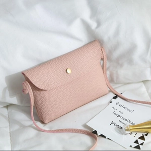 Pink lychee grain leather crossbody envelope bag with gold magnetic buckle closure