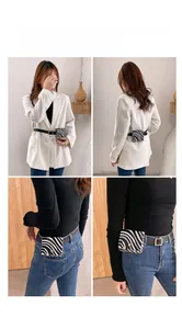 Fashionable zebra print mini waist bag with black strap styled on a white blazer