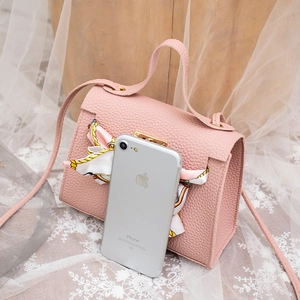 Pink lychee grain leather mini bag with silk scarf and phone size reference