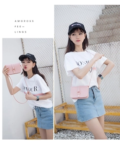 Detail of pink PU leather crossbody bag with elegant golden ring buckle and strap