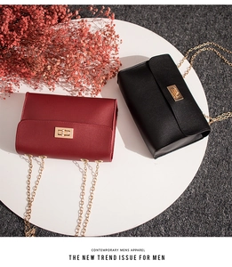 Fashionable leather crossbody bags in burgundy and black with gold chain and twist lock