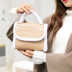 Winter beige crocodile pattern handbag with white plush trim and round ring handle