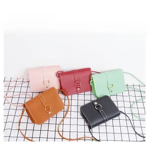 Selection of minimalist crossbody phone bags in five colors on a checkered background