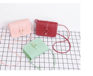 Three minimalist PU leather mini crossbody bags in pink, wine red, and mint green colors
