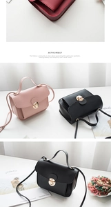 Close-up of elegant small square bags with golden twist lock and adjustable shoulder straps