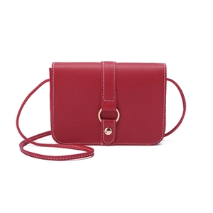 Minimalist red leather mini square crossbody bag with white contrast stitching and gold ring
