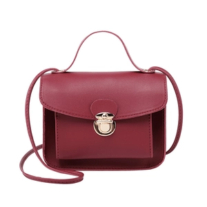 Classic burgundy faux leather square handbag with golden metal clasp and top handle