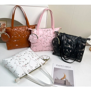 Quilted tote bag set with floral embroidery and matching small round coin purse charms
