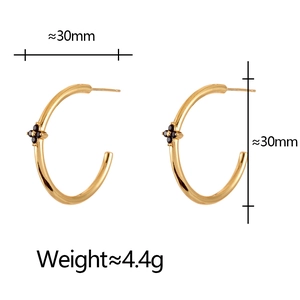Detail showing gold hoop earring with black flower and 30mm diameter dimensions