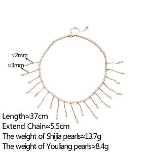 Detail of pearl tassel necklace featuring 2mm small pearls and golden chain fringes