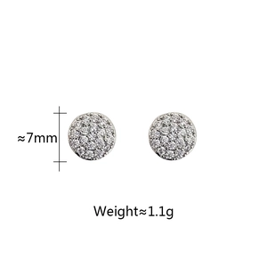 Detail view of 7mm silver-tone round stud earrings with micro-paved cubic zirconia