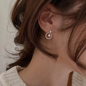 French vintage pearl drop earrings with geometric pavé zircon hoops on model