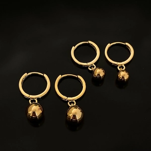 Elegant gold-plated geometric hoop earrings with polished sphere pendants on black background