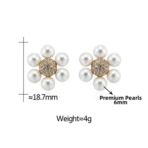 Detailed view of french style daisy earrings with 6mm pearls and crystals