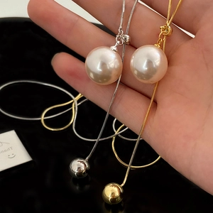 Adjustable pearl sweater necklace with gold and silver snake chains for women