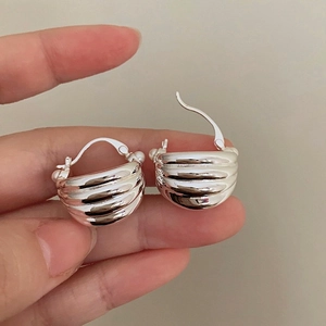 French vintage striped silver metal earrings in a shell-shaped croissant design