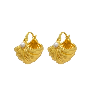 French vintage gold shell earrings with elegant white pearls on a clean white background