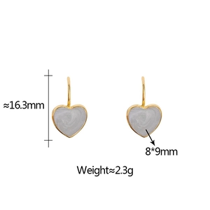 Detail view of heart-shaped earrings with gold trim and size specifications 8x9mm