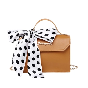 Brown PU leather crossbody bag with chain strap and polka dot bow decoration