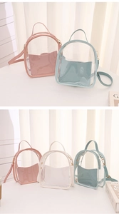 Detailed close-up of transparent PVC mini backpacks with colorful PU leather trim and gold hardware