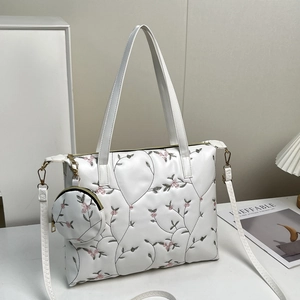 White tote bag with pink floral embroidery and matching round mini pouch accessory