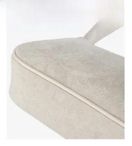 Detail of gray shoulder bag featuring precision double stitching and matte leather texture
