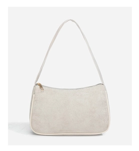 Detailed close-up of beige suede shoulder bag with gold zipper and leather trim
